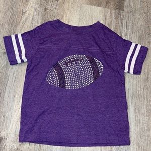 Studded purple football tee size 2. Gently used.